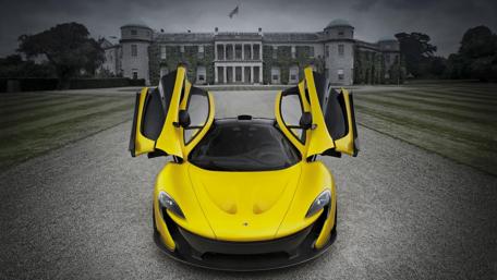 Ultimate McLaren P1 in Front of Luxurious Mansion wallpaper