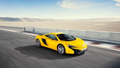 Sleek Yellow McLaren 625C on the Track wallpaper