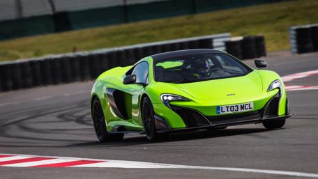 Vivid McLaren 675LT in Action on the Track wallpaper