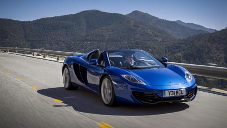 Sleek McLaren MP4-12C Spider on Scenic Roadway wallpaper