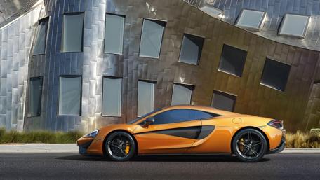 Sleek McLaren 570S Against Modern Architecture wallpaper