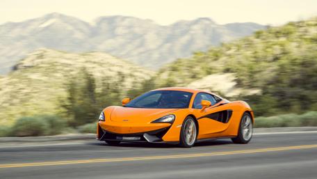 Vibrant McLaren 570S on a Scenic Drive wallpaper