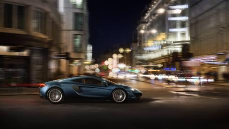 Sleek McLaren 570GT Among Stunning City Lights wallpaper