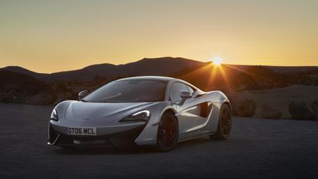 Sleek McLaren 570GT in Stunning Sunset Setting wallpaper