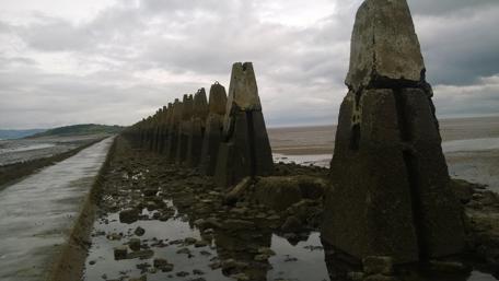 Scenic Scottish Rock Formation Under Dramatic Skies wallpaper