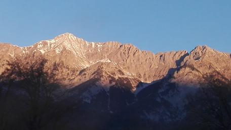 Majestic Alpine Peaks in Sunrise Glow wallpaper