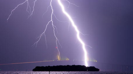Thunderous Lightning over Island Bridge at Night wallpaper