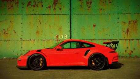 Sleek Porsche Against Rustic Backdrop wallpaper
