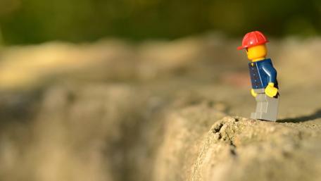 Lego Figure Contemplating Life's Journey wallpaper