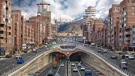 Urban Landscape Surrounded by Majestic Mountains wallpaper
