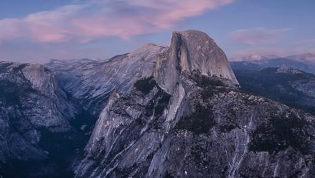 Majestic Mountain Peaks under Painted Sky wallpaper