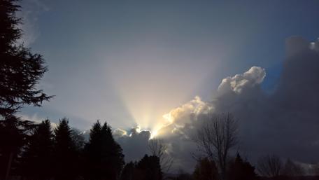Radiant Sunrise Breaking Through Clouds wallpaper