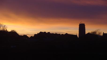 Serene Sunset Over Mechelen's Romboutstower wallpaper