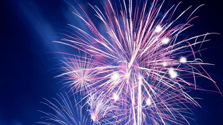 Festive Fireworks Illuminating the Night Sky wallpaper