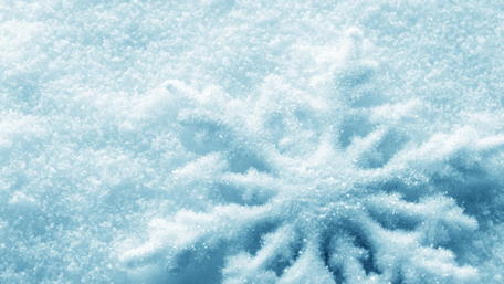 Glittering Snowflake on Soft Snow Surface wallpaper