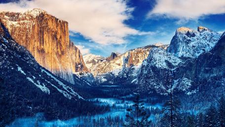 Majestic Winter Mountains Bathed in Sunlight wallpaper