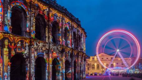 Vibrant City Nightscape with Iconic Landmarks and Lights wallpaper