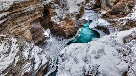 Majestic Athabasca Falls in Winter Wonderland wallpaper