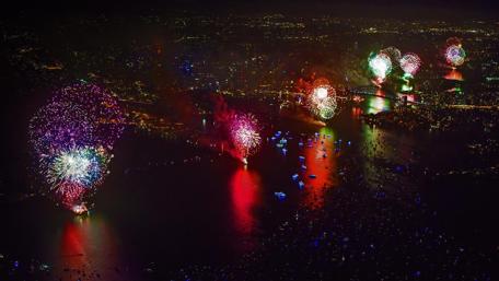 Vibrant New Year Celebrations Above the Cityscape wallpaper