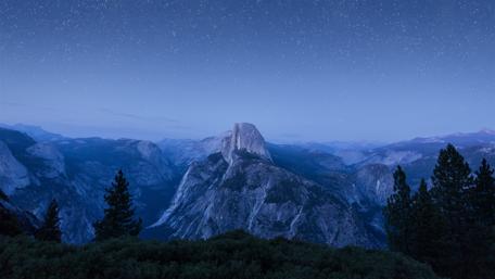 Starry Night Over Majestic Mountains wallpaper