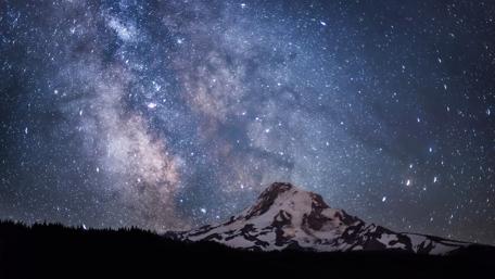 Starlit Majesty over a Winter Mountain wallpaper