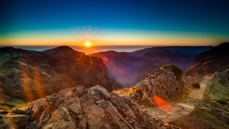 Sunset Over Majestic Mountain Rocks wallpaper