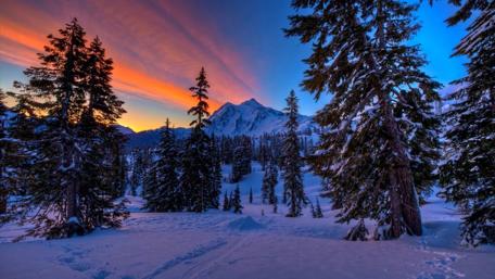 Majestic Winter Landscape with Sunset Glow wallpaper