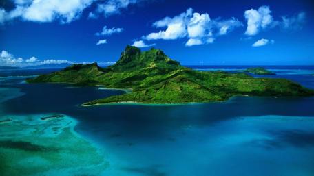 Breathtaking Island Paradise Over Crystal Waters wallpaper