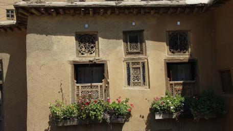Charming Rustic Windows with Vibrant Flowers wallpaper