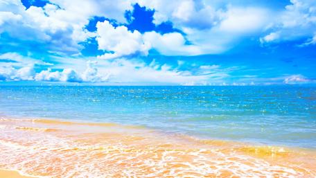 Serene Beach with Blue Sky and Water wallpaper