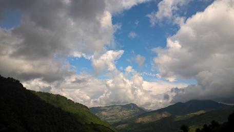 Majestic Mountains Under Dynamic Skies wallpaper