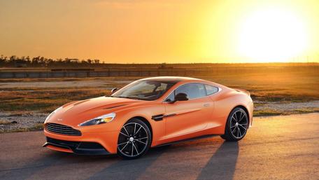 Sleek Orange Dream Car at Sunset wallpaper