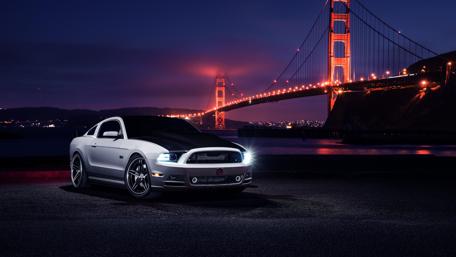 Sleek Mustang by the Golden Gate Bridge at Night wallpaper