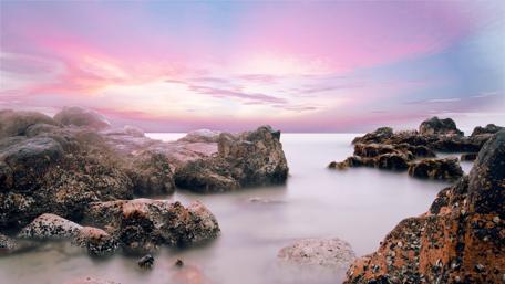 Misty Dawn Over Serene Rocks in 4K Quality wallpaper