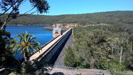 Serene View of Cataract Dam Wall Amidst Nature wallpaper