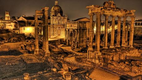 Ancient Ruins Illuminated at Night wallpaper