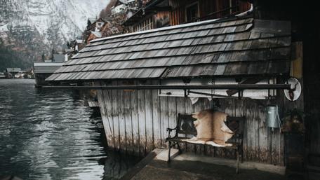 Serene Cottage by the Snowy Water wallpaper
