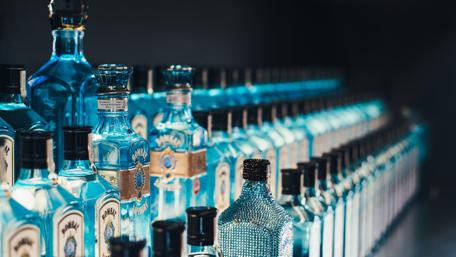 Elegant Blue Bottles Displayed in Rows for Inspiration wallpaper