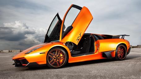 Sleek Dream Car in Vibrant Orange Shade wallpaper