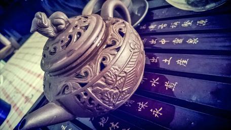 Elegant Teapot with Traditional Patterns wallpaper