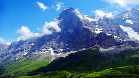 Majestic Peaks Under a Clear Blue Sky wallpaper