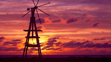 Serene Sunset with Windmill Silhouette wallpaper