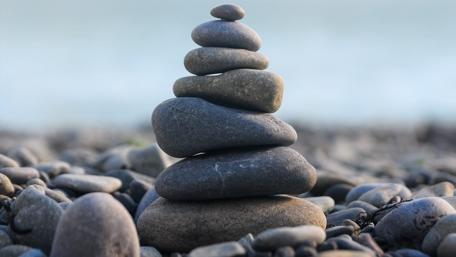 Nature's Harmony in Stone Stacking wallpaper