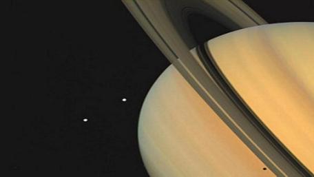 Majestic Saturn with Its Iconic Rings and Moons wallpaper