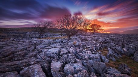 Tranquil Sunset Over Stony Landscape wallpaper