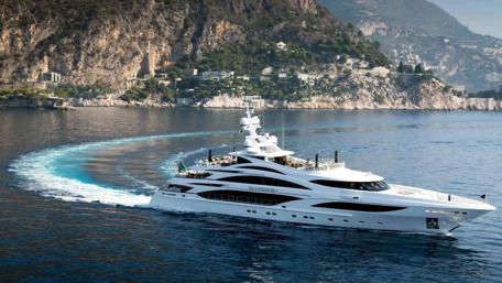 Elegant Yacht Sailing through Serene Waters of the Coastline wallpaper