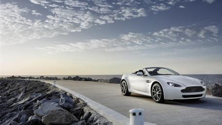 Sleek White Convertible by the Ocean wallpaper