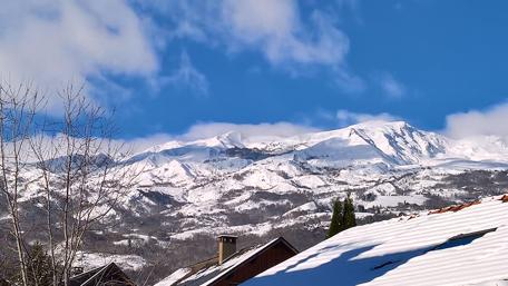Winter Paradise Above Rooftops of Snowy Mountains wallpaper