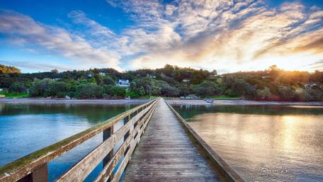 Serene Sunset Over the Wooden Pier wallpaper