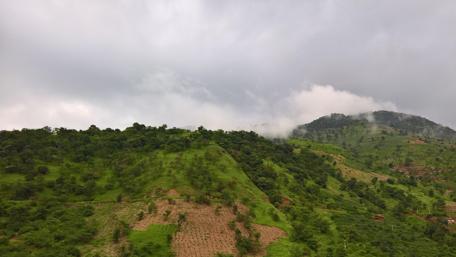 Majestic Mountain Landscape Under Cloudy Skies wallpaper